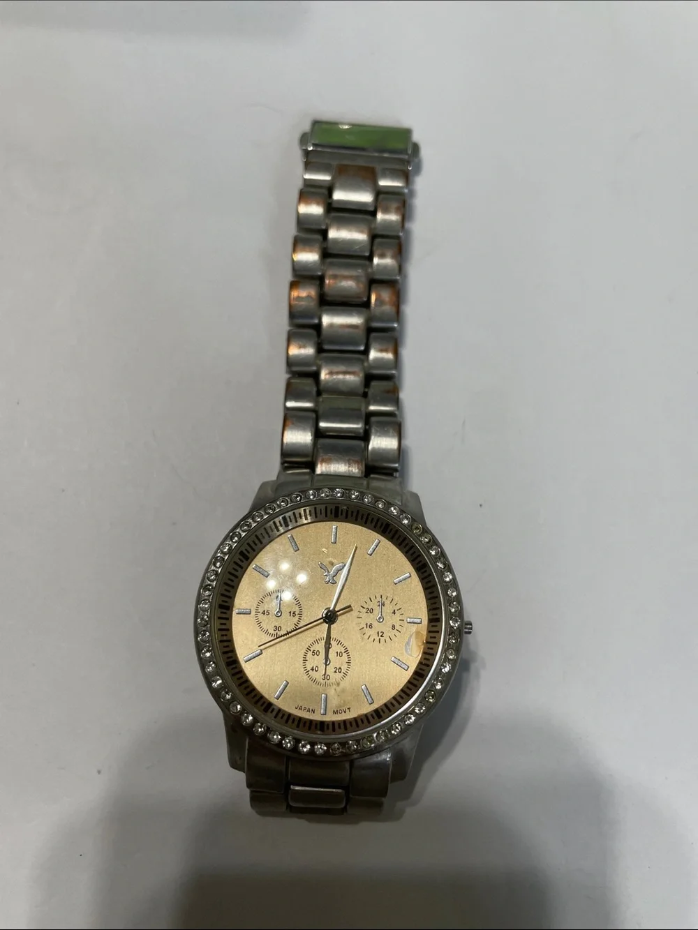 American Eagle Outfitters Men's Silver Watch with Gold Dial. Needs Battery.